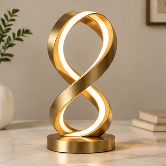 ESSENTIN Infinity LED Table Lamp glowing on a marble surface in a modern living room setting