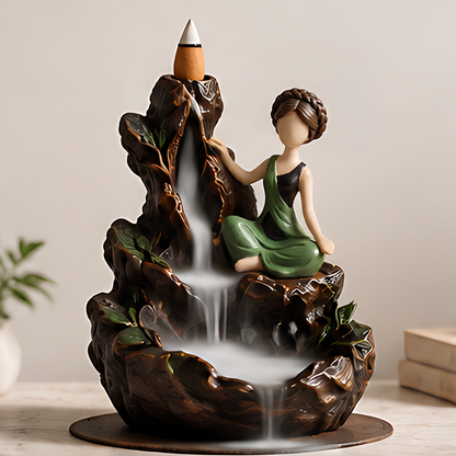 ESSENTIN Waterfall Backflow Incense Burner with smoke cascading down mountain sculpture — tranquility home decor