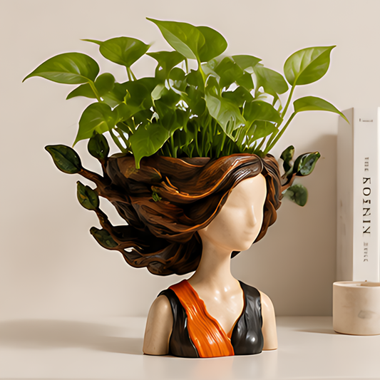 ESSENTIN Nature Spirit Lady Head Planter with green pothos plant on a white surface — artistic home decor